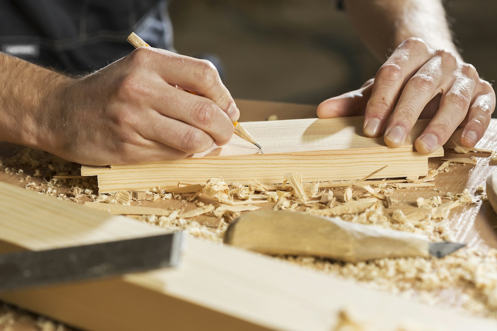 Custom carpentry workspace with wood and precision tools